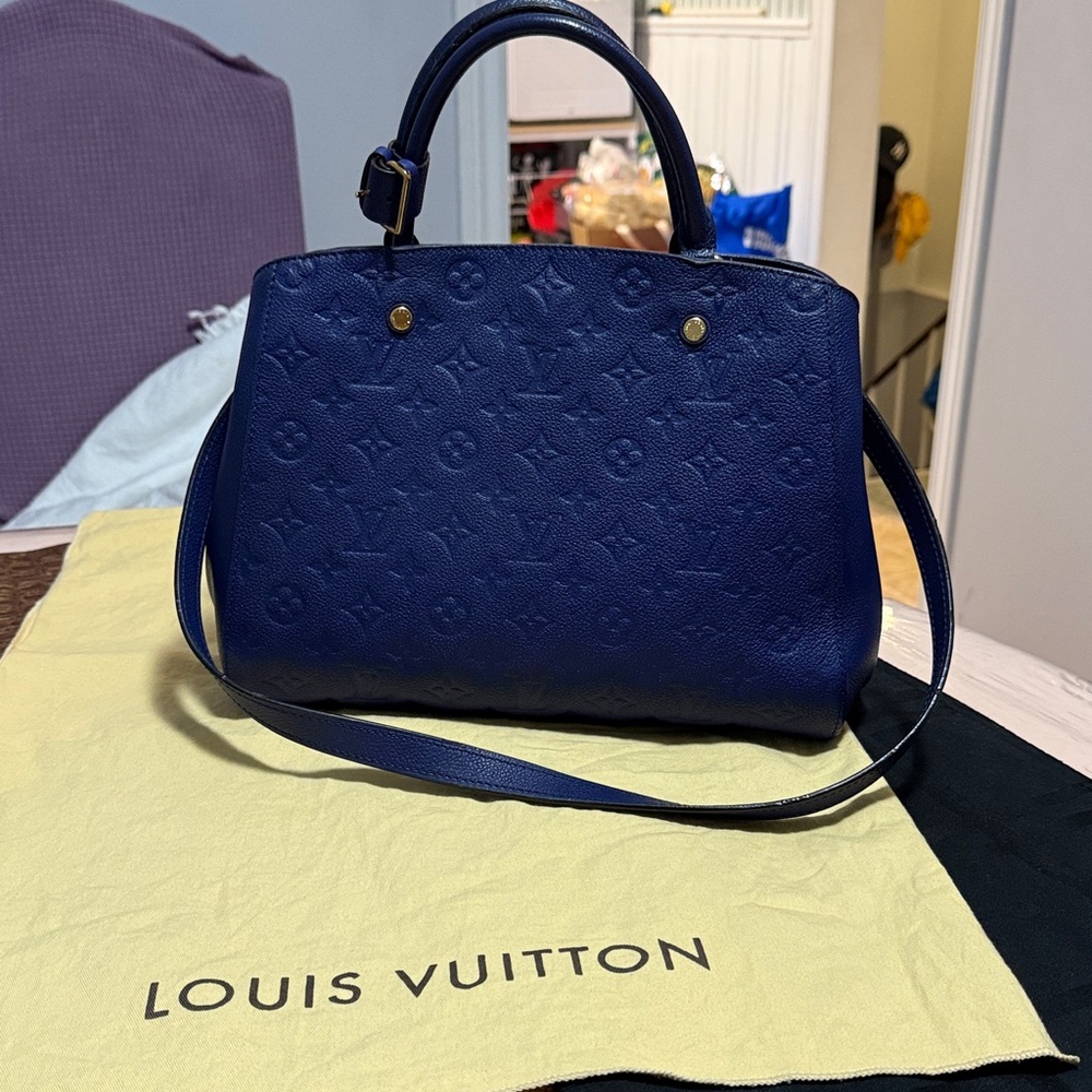 Authentic Louis Vuitton  Monogram Empreinte  Blue Leather Satchel.